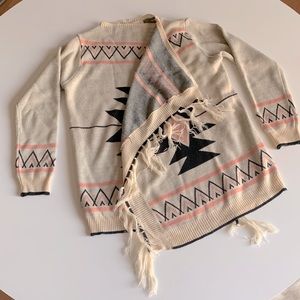 Poncho/wrap sweater with fringe detail